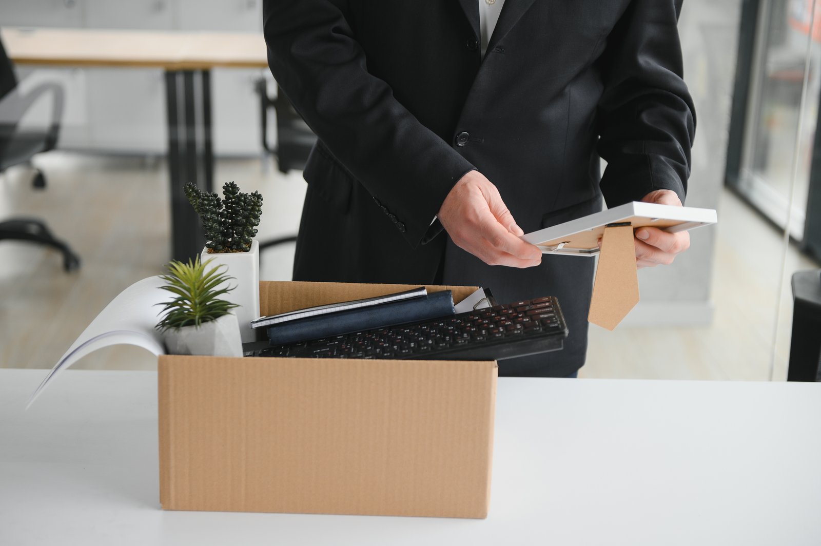 Corporate document protection: employee leaving the office with a box of personal items